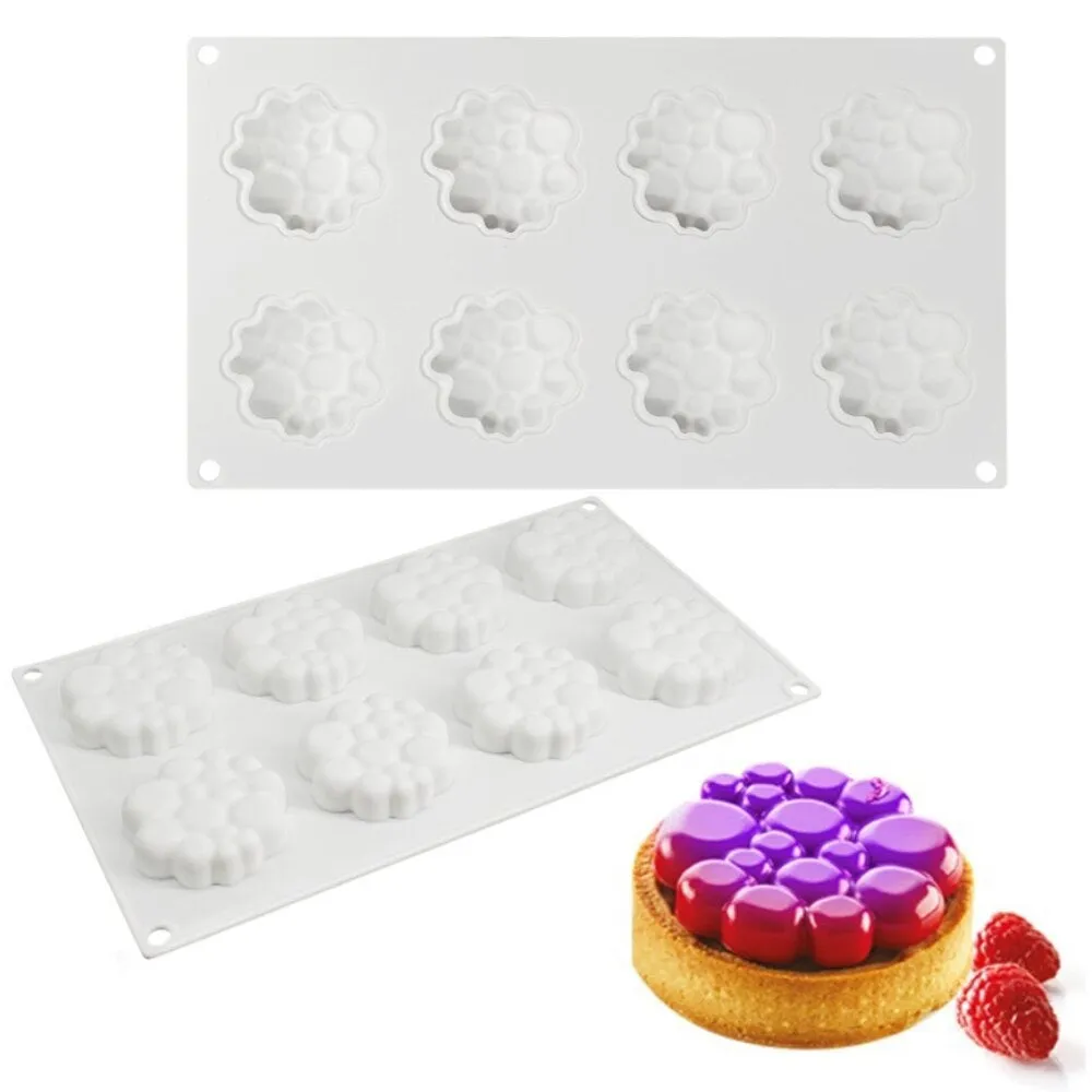 Round silicone baking mould with eight bubble indentations for cakes and desserts