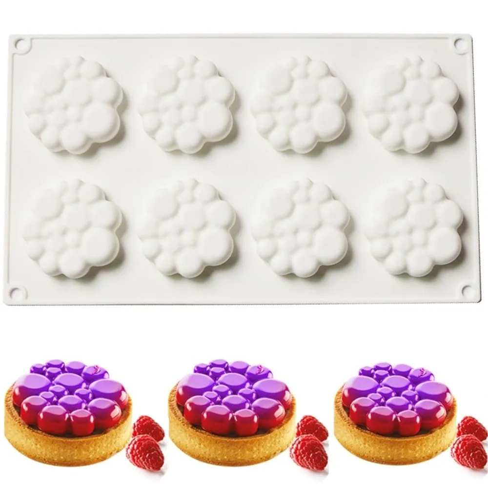 Round silicone baking mould with eight bubble indentations for cakes and desserts