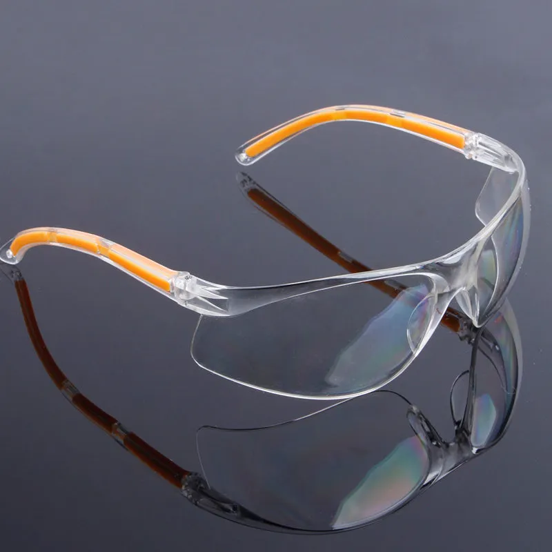 Transparent safety goggles with yellow frame made from impact-resistant polycarbonate