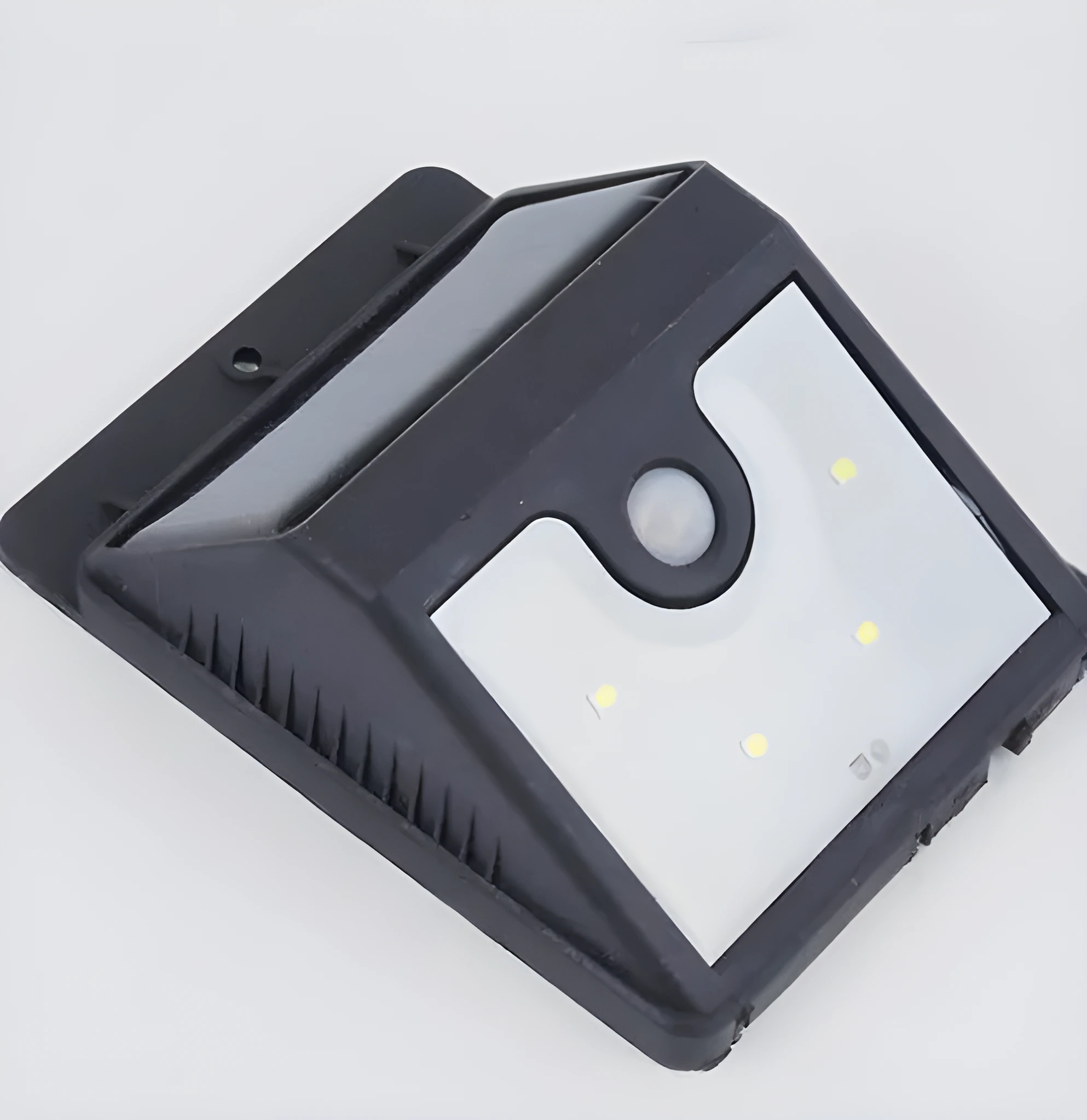 Set of four white outdoor solar security lights with motion sensors mounted on a wall.
