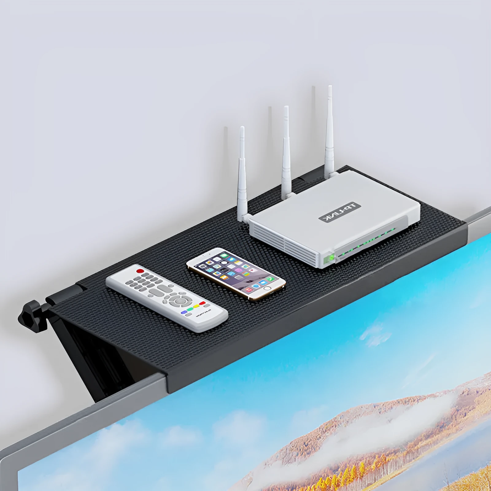 Plastic hook-mount rack holding a set-top box and router on a desktop.