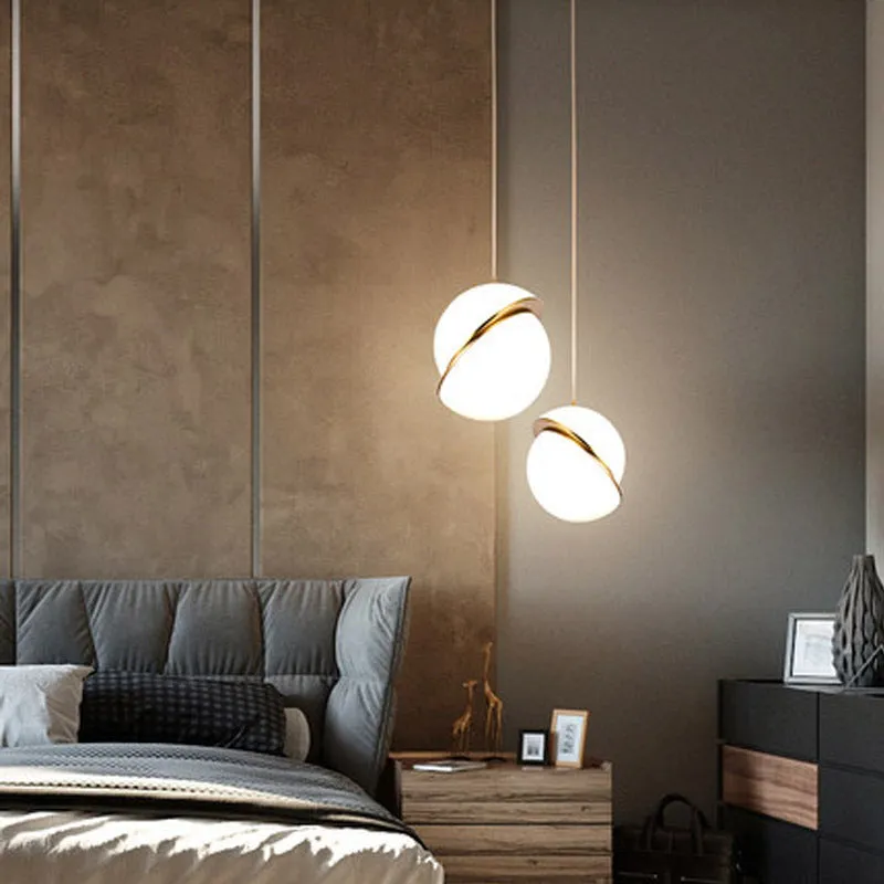 White spherical LED pendant light with adjustable chain for dining room or bedroom ceiling mounting