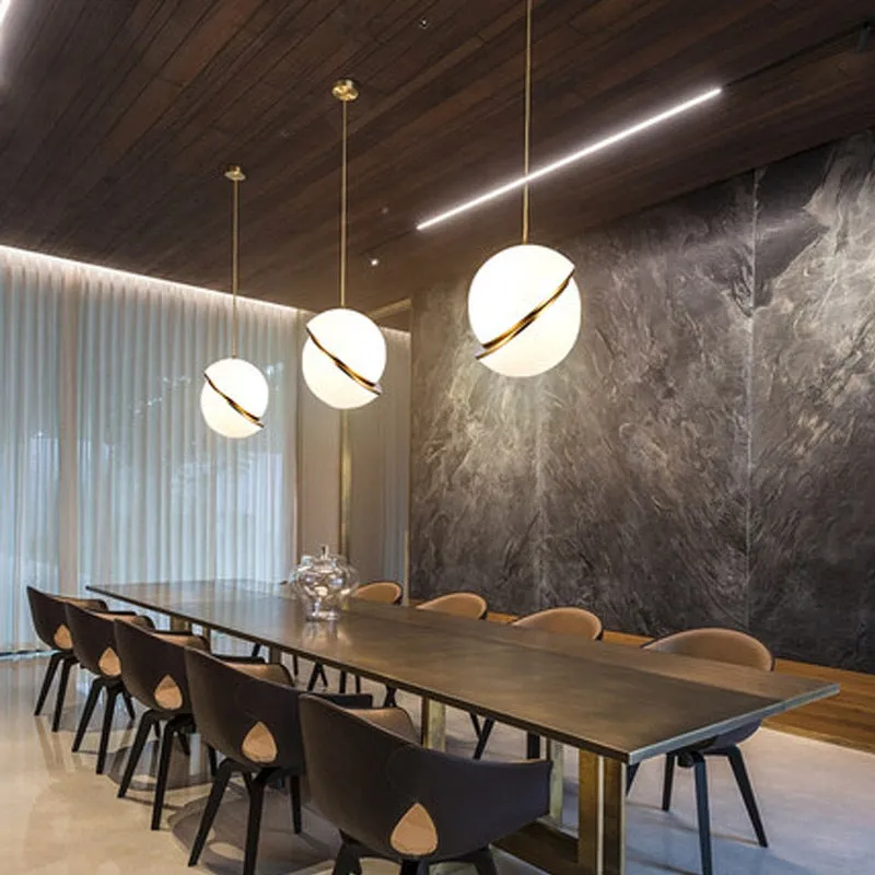 White spherical LED pendant light with adjustable chain for dining room or bedroom ceiling mounting