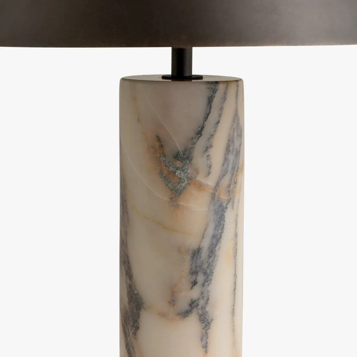 Modern black table lamp with a textured marble base on a wooden desk.