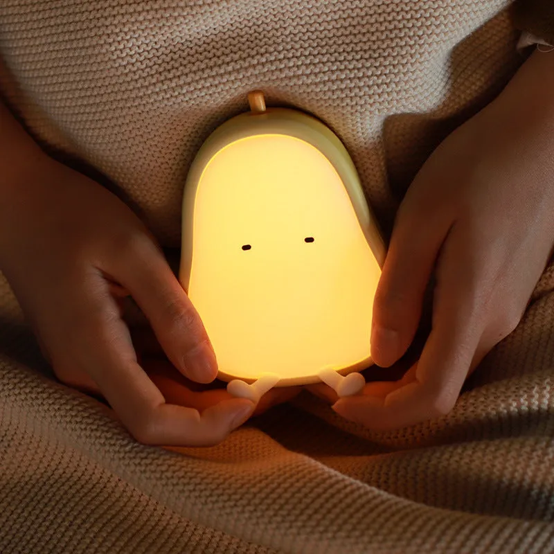 PEAR NIGHT LAMP rechargeable silicone bedside light with warm yellow glow on a surface