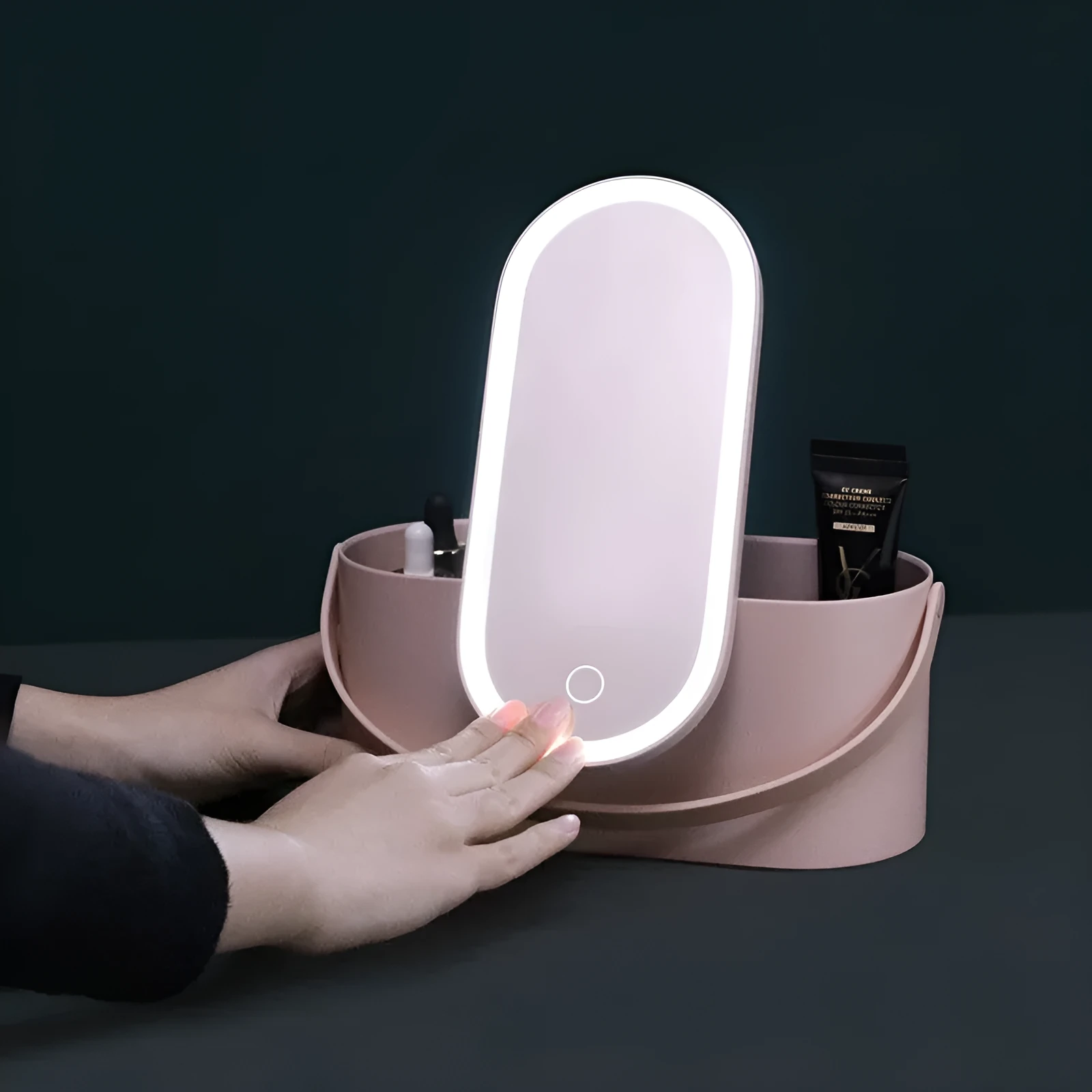 Portable pink plastic storage box with a built-in rectangular aluminium makeup mirror.