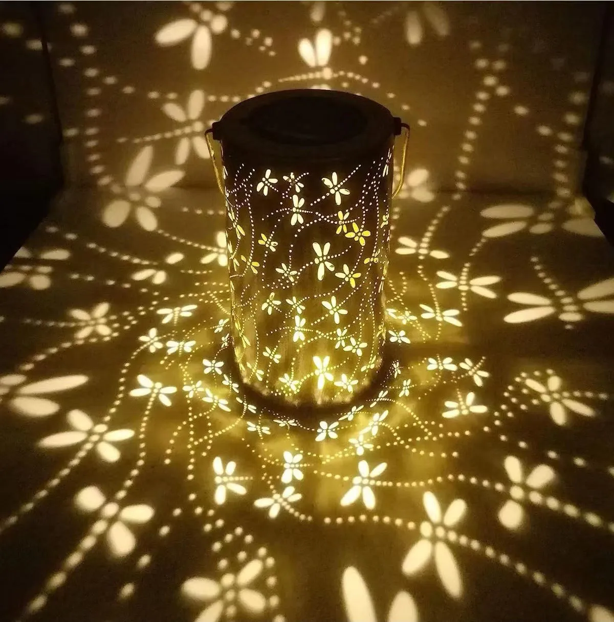 Solar-powered iron courtyard hanging lamp with decorative design for outdoor garden use.