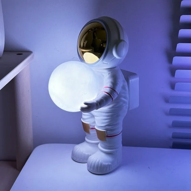 Spaceman Starry Sky Projection Lamp showing star projection effect and Bluetooth speaker