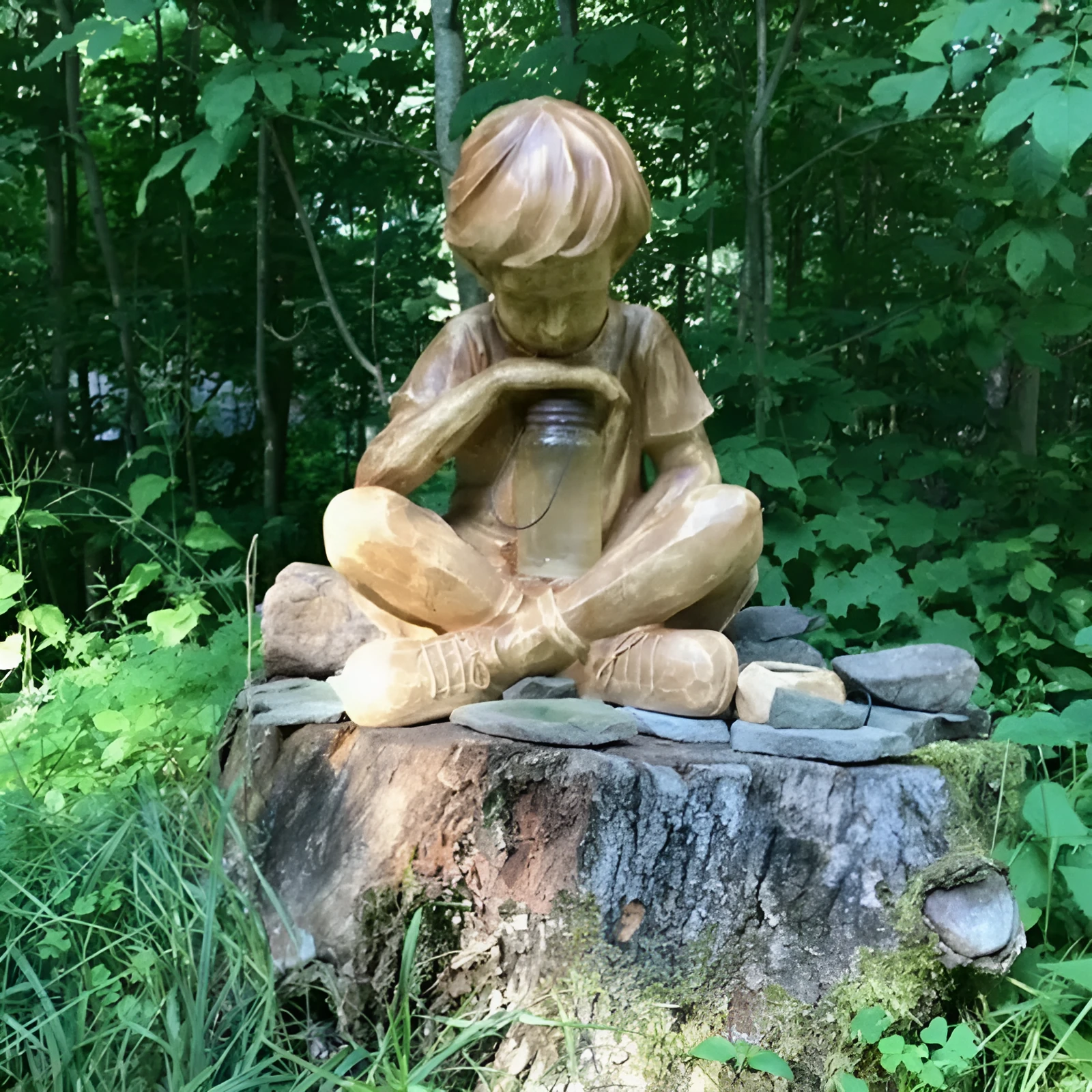 Brown natural resin statue of a little boy garden ornament for tabletop decoration.
