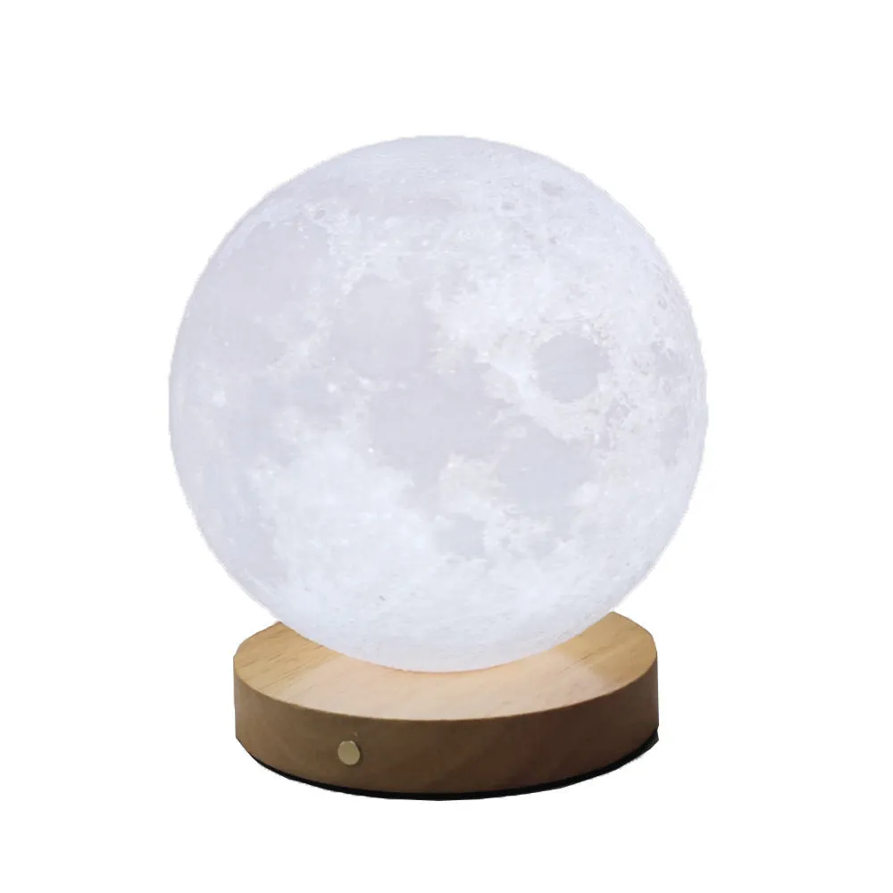 Rotating moon night light on a wooden base with a wire remote, shown in three available sizes.