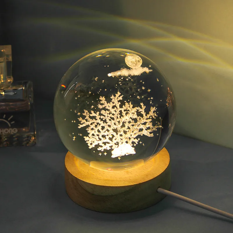 Transparent crystal ball night lamp with carved jellyfish design illuminated by internal LED light