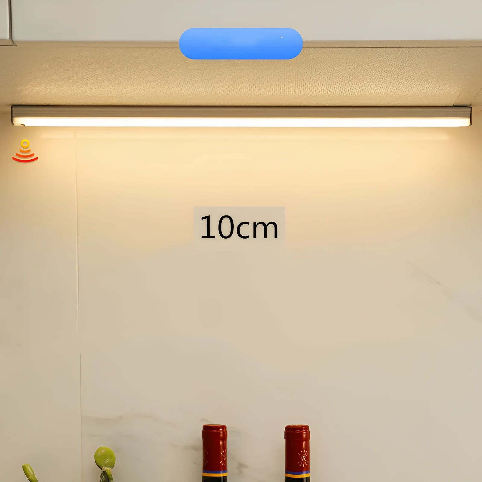 Hand-scanning rechargeable LED strip light for cabinets with magnetic and adhesive backing.