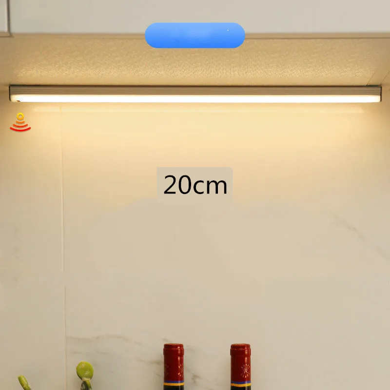 Hand-scanning rechargeable LED strip light for cabinets with magnetic and adhesive backing.