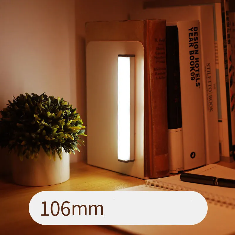 Hand-scanning rechargeable LED strip light for cabinets with magnetic and adhesive backing.
