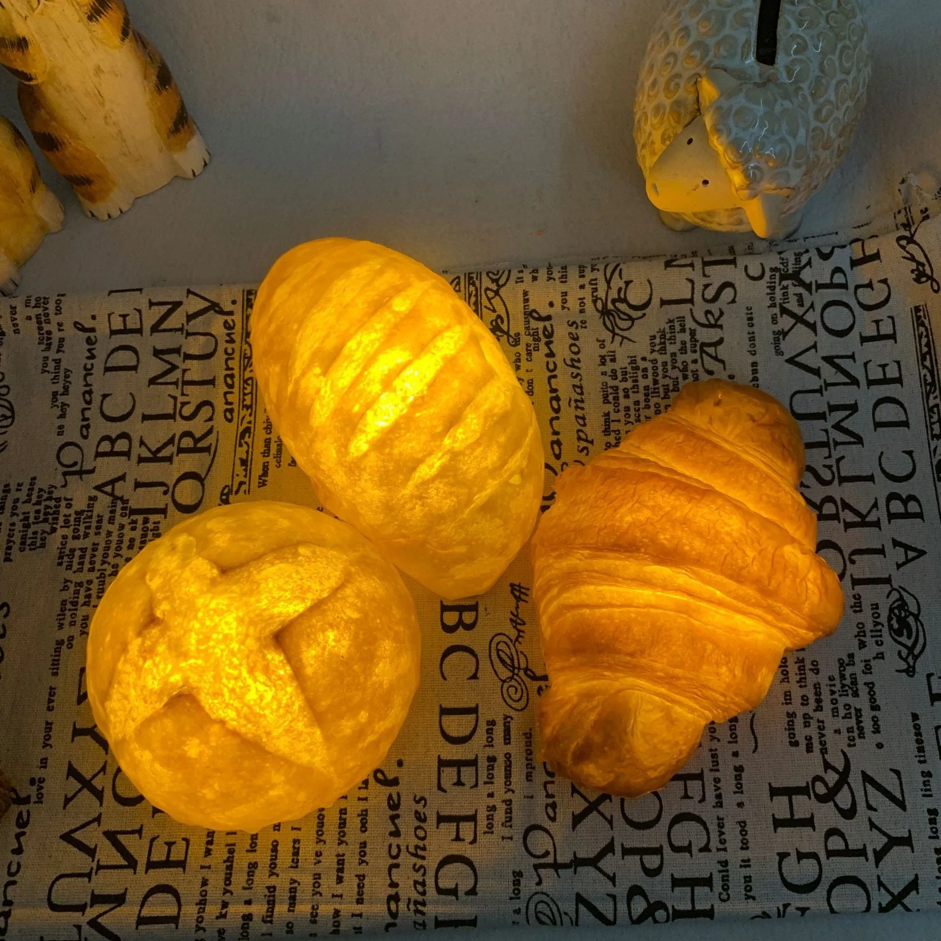 Creative croissant-shaped LED night light with milk bag decoration, modern minimalist design