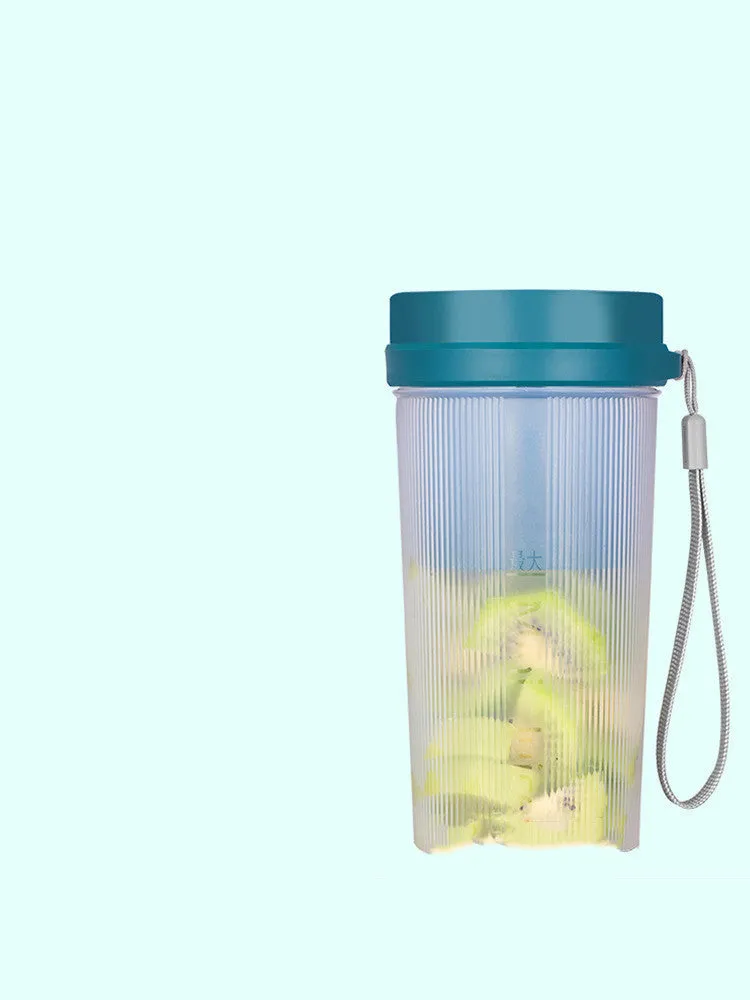 Portable pink and green rechargeable electric juicer cup with USB charging cable.