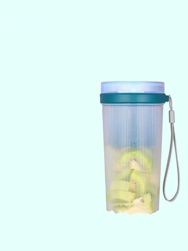 Portable pink and green rechargeable electric juicer cup with USB charging cable.