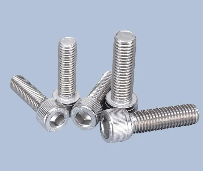 Stainless steel phono cartridge mounting kit with allen bolts, nuts, washers, and two allen keys on a white background.