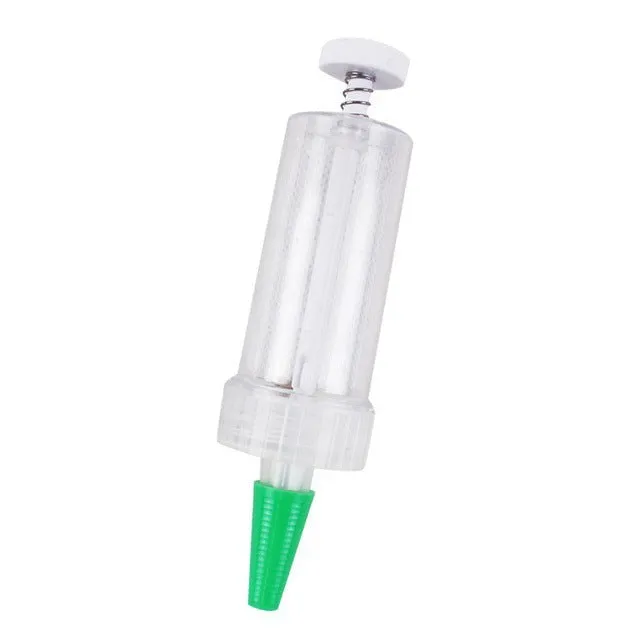 Plastic mini garden seeder tool measuring 12cm long for precise seed planting in pots