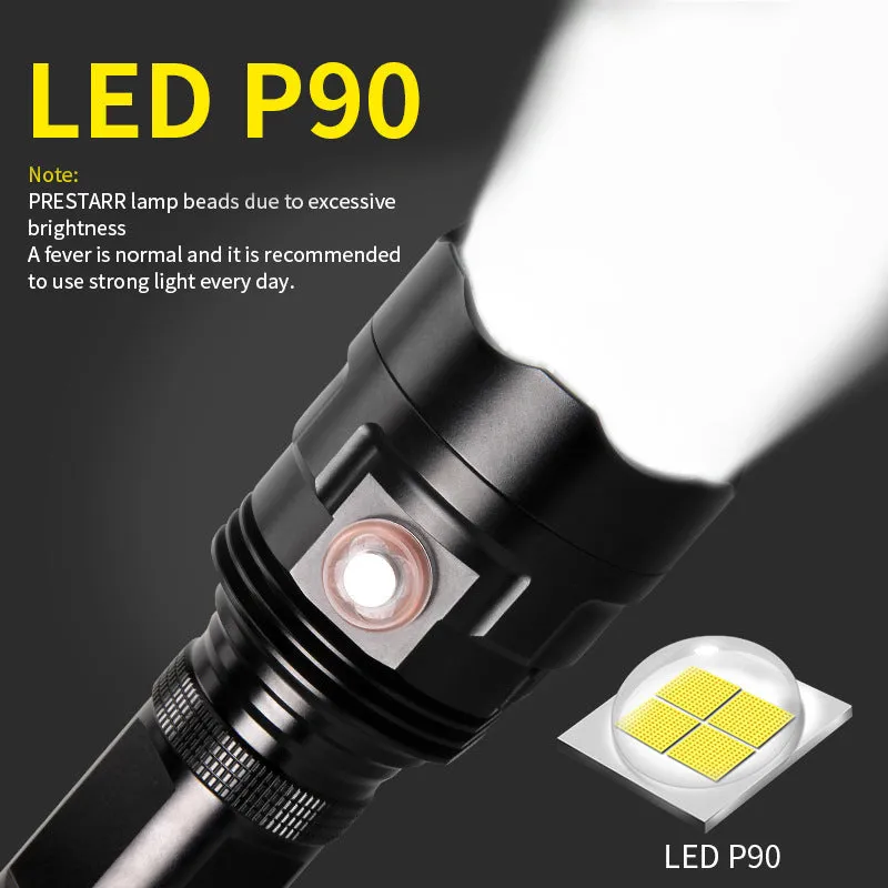 Black aluminium alloy XHP90 LED tactical flashlight showing dimensions and switch.