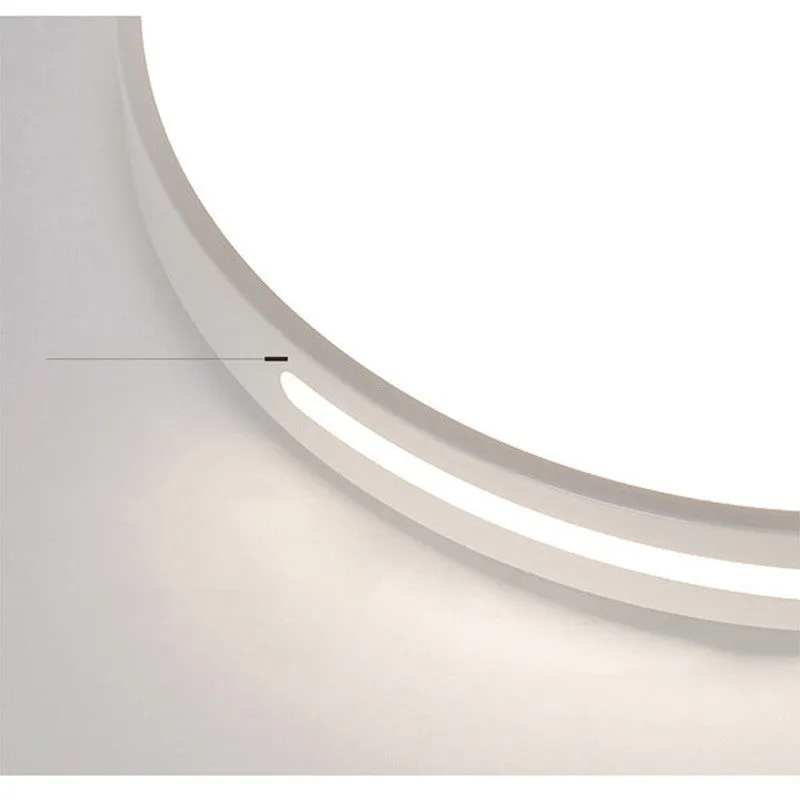 Round white acrylic remote control LED ceiling lamp mounted on a bedroom ceiling.