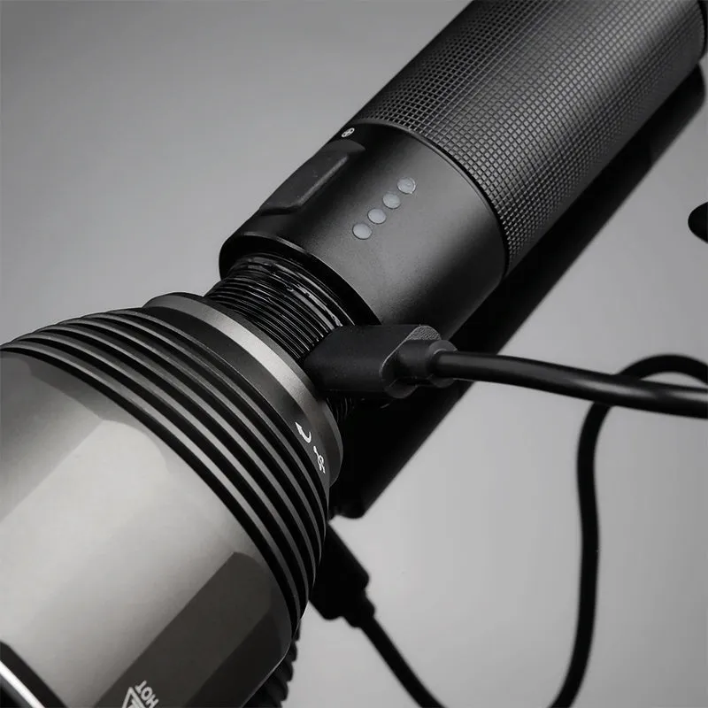 Black rechargeable outdoor flashlight showing aluminium construction with measurement indicators