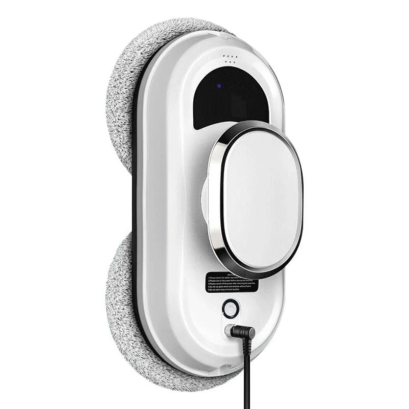 White automatic high-altitude cleaning machine with remote control on a windowsill.
