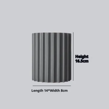 Nordic style wall light with a white macaron shell-shaped shade mounted on a hallway wall.