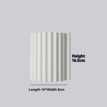 Nordic style wall light with a white macaron shell-shaped shade mounted on a hallway wall.