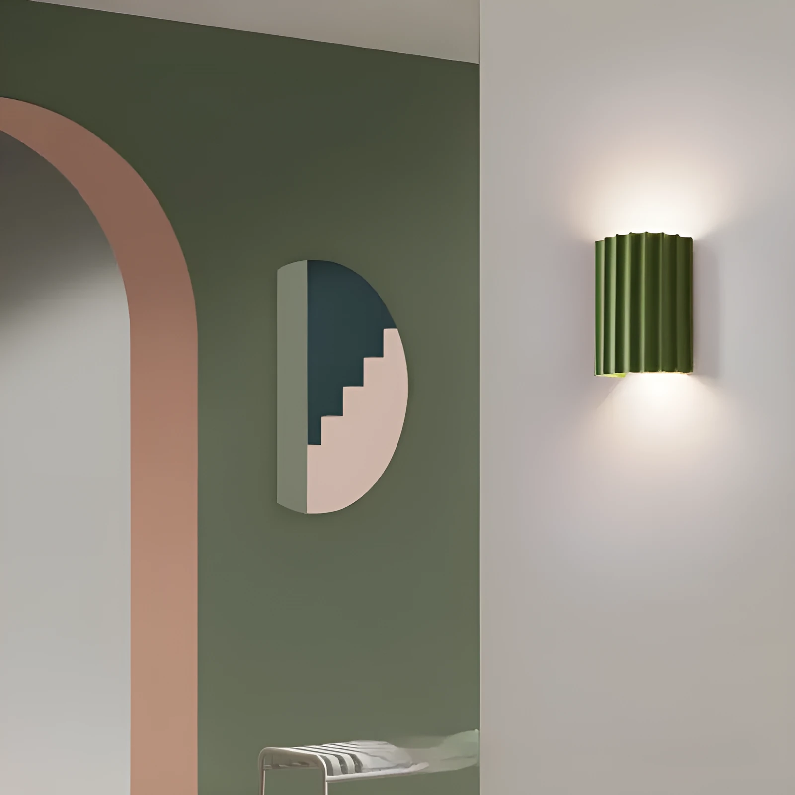 Nordic style wall light with a white macaron shell-shaped shade mounted on a hallway wall.