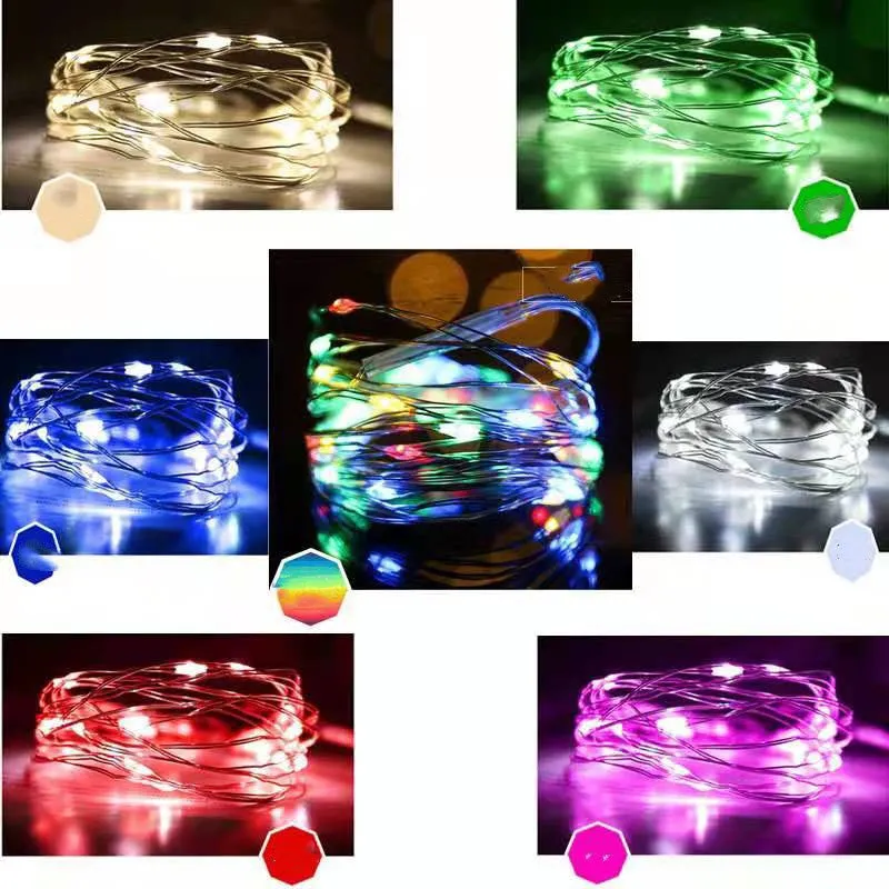 Copper wire LED string light wrapped around a tree branch, showing multiple coloured bulbs.