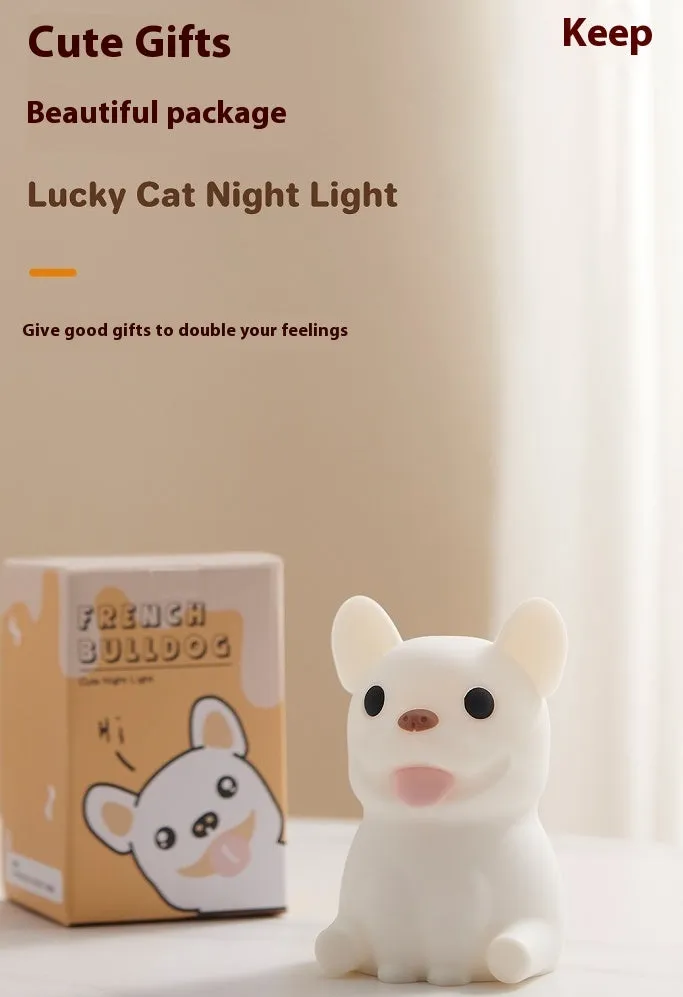 Silicone animal cartoon USB night light with Zodiac design on a bedside table.