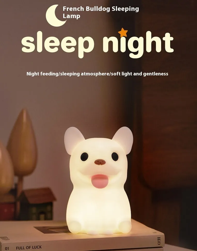 Silicone animal cartoon USB night light with Zodiac design on a bedside table.