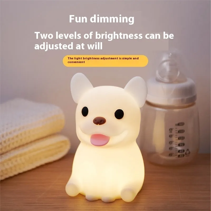 Silicone animal cartoon USB night light with Zodiac design on a bedside table.