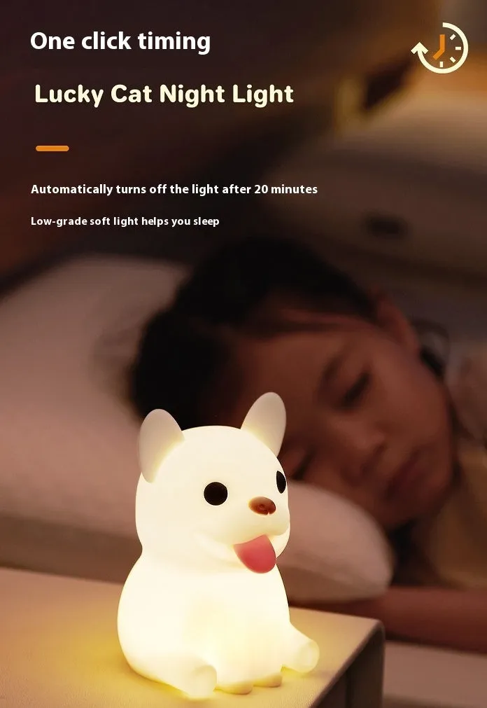 Silicone animal cartoon USB night light with Zodiac design on a bedside table.