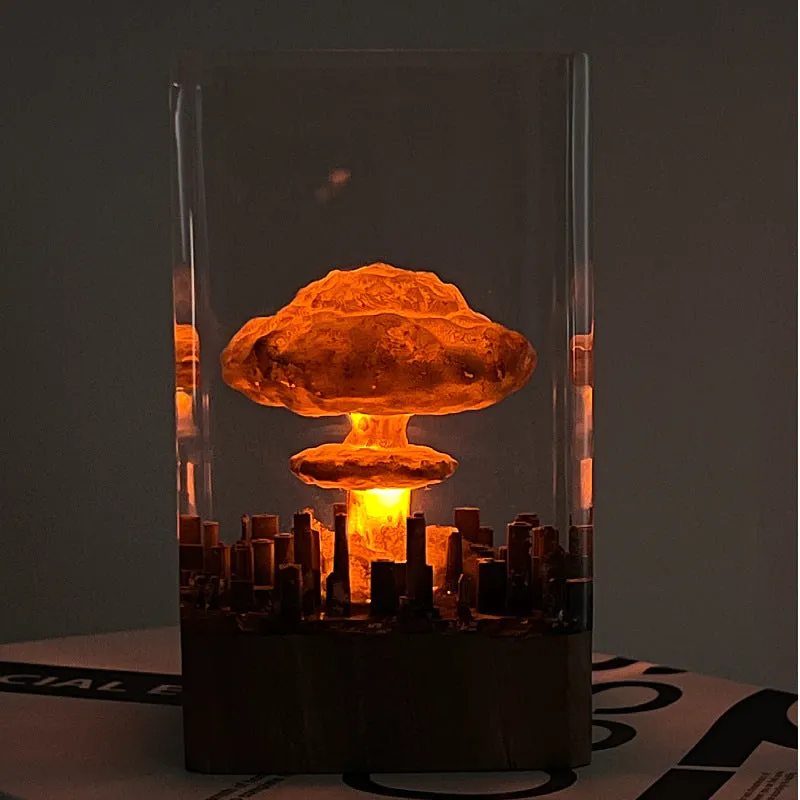 Small resin night lamp shaped like an atomic bomb mushroom cloud explosion in two colour variants.