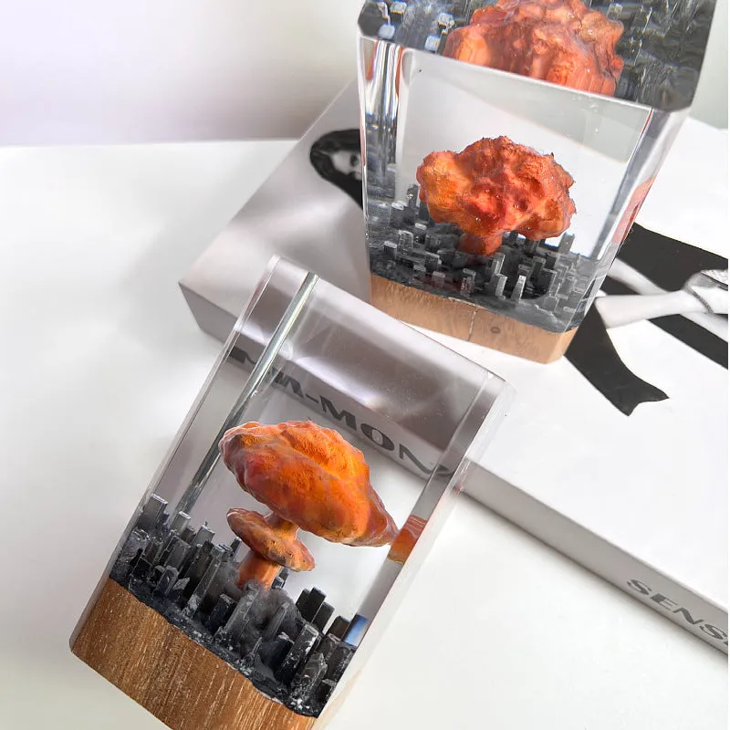Small resin night lamp shaped like an atomic bomb mushroom cloud explosion in two colour variants.