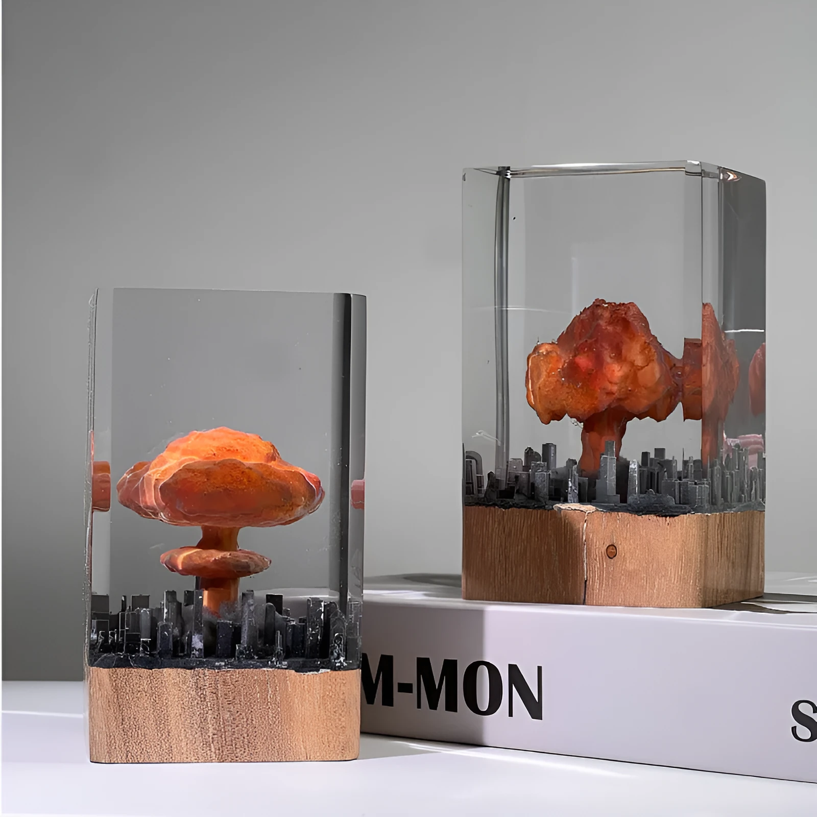 Small resin night lamp shaped like an atomic bomb mushroom cloud explosion in two colour variants.
