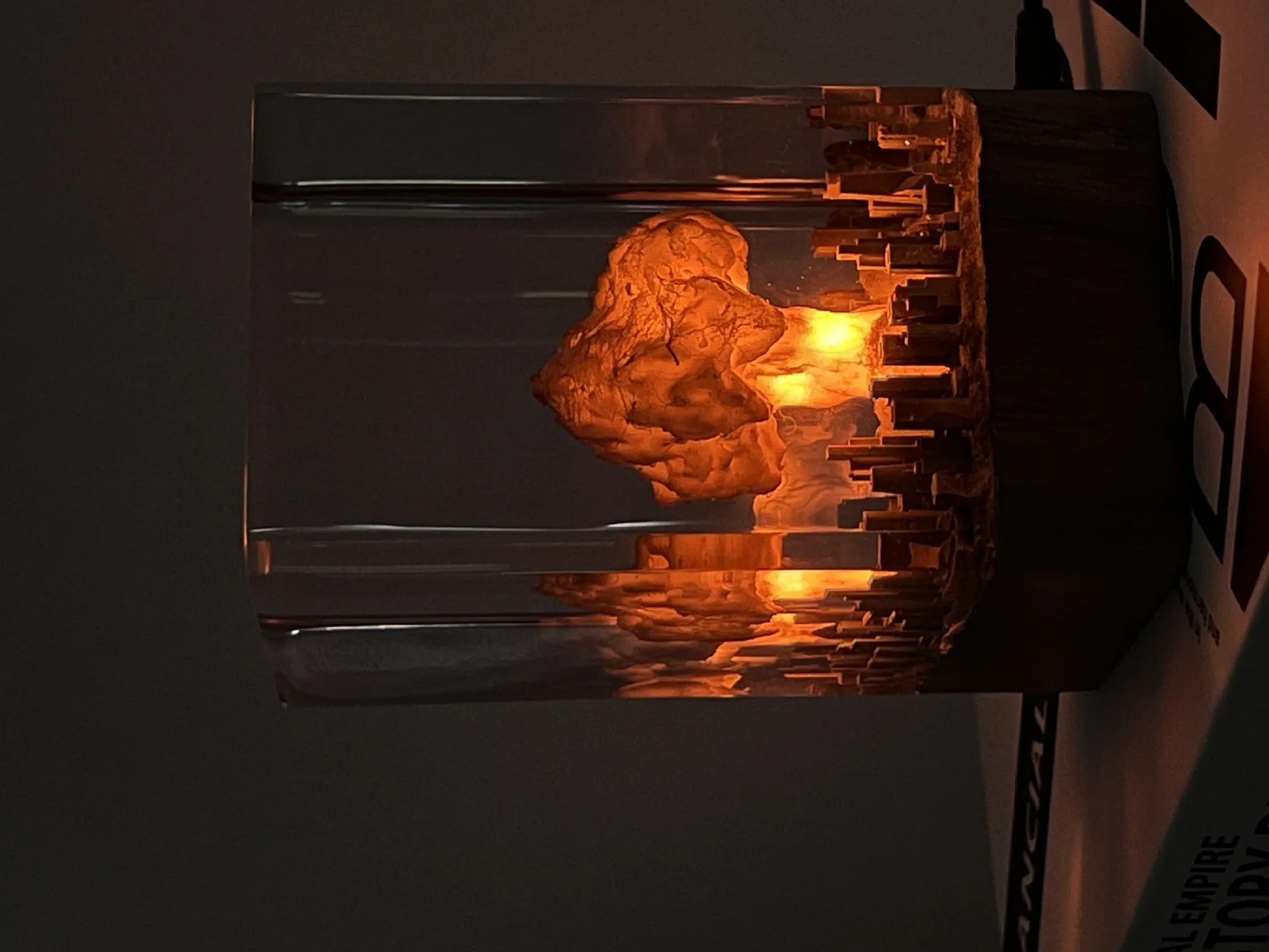 Small resin night lamp shaped like an atomic bomb mushroom cloud explosion in two colour variants.