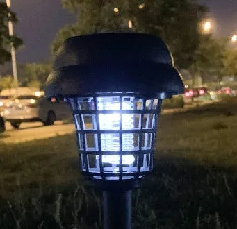 Solar mosquito killer lamp with white LED light and purple UV attraction for outdoor insect control