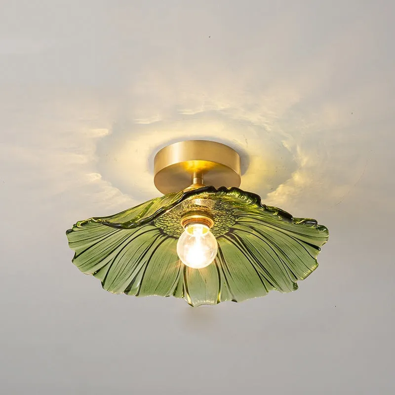 Nordic Japanese style lotus leaf shaped ceiling or pendant lamp with iron frame and glass shade.
