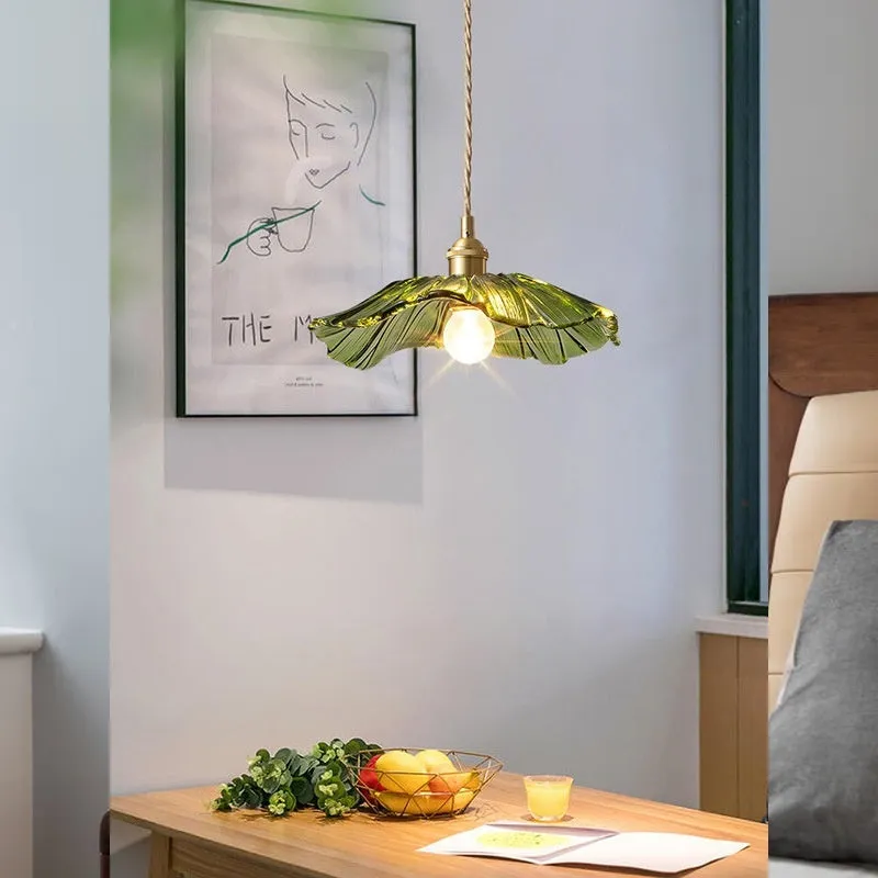 Nordic Japanese style lotus leaf shaped ceiling or pendant lamp with iron frame and glass shade.