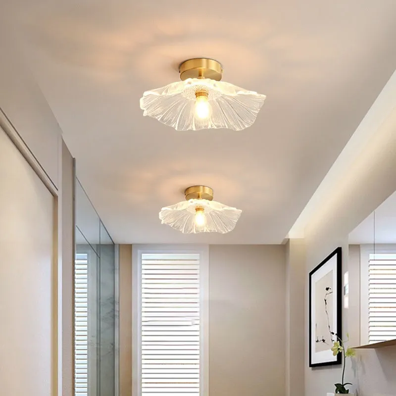Nordic Japanese style lotus leaf shaped ceiling or pendant lamp with iron frame and glass shade.