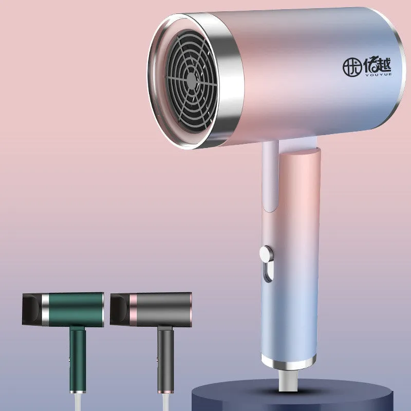 Foldable negative ion hair dryer in emerald green with folded handle and single nozzle