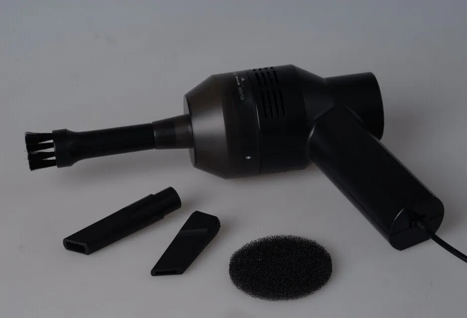 Black desktop mini vacuum cleaner with USB cable for computer keyboard and electronic dust removal