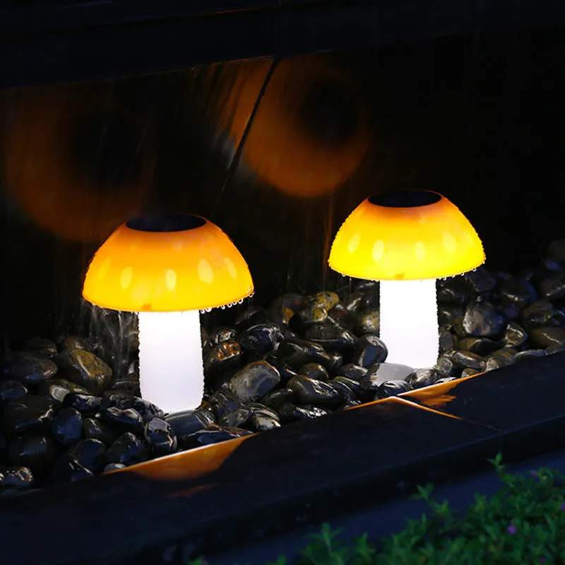 Solar garden mushroom light with ground spike for lawn and pathway illumination.