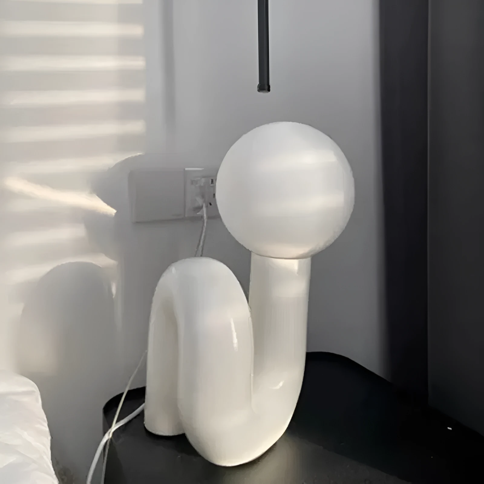 Pink and white resin bedside lamp with graphic customisation option for children's bedrooms