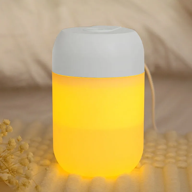 Small white cylindrical USB-powered humidifier with charging cable.