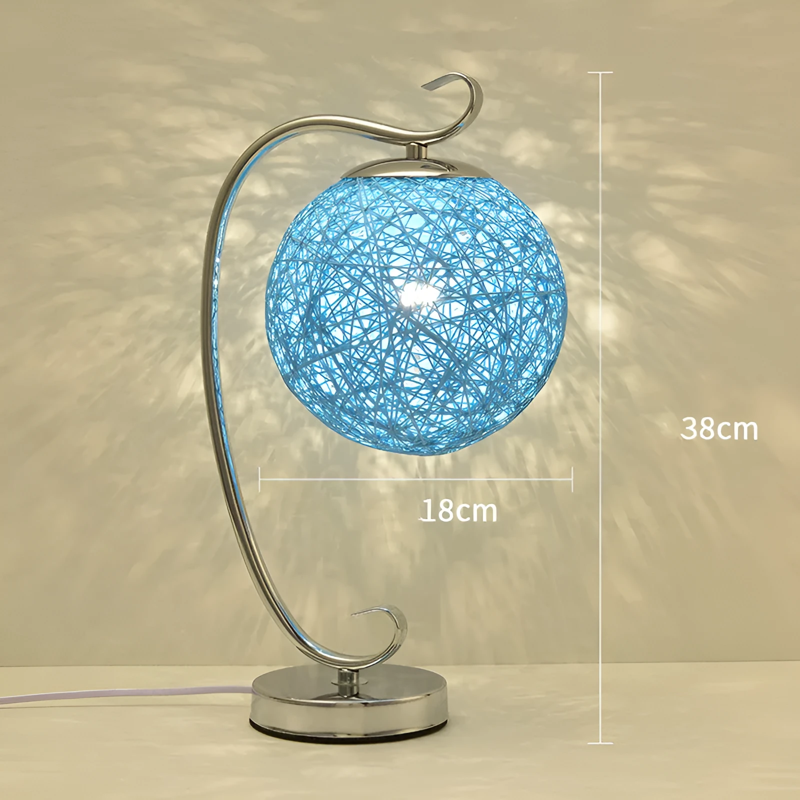 Small dimmable night light with cloth shade and iron base, showing remote control.