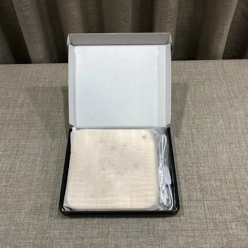 Square pine wood USB LED atmosphere lamp with warm white light on a table.